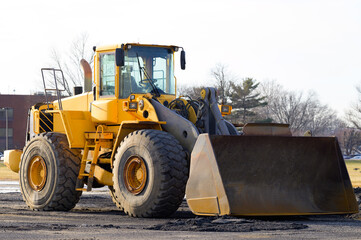Obraz na płótnie Canvas front loader yellow heavy tractor shovel