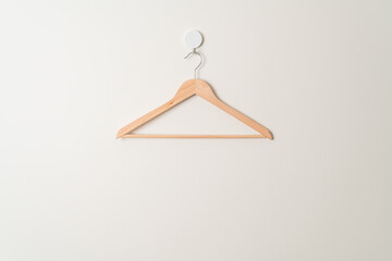 wood clothes hanger on wall