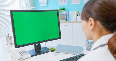 female doctor use computer