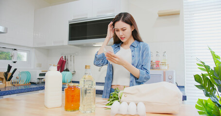 woman look at shopping bills