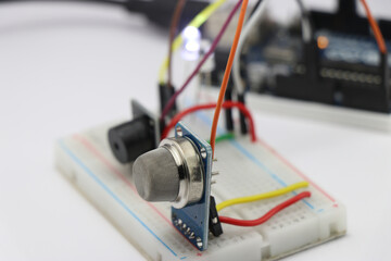 Circuit creation with electronic components on a breadboard, Prototype of gas leakage detection project using MQ2 sensor and buzzer
