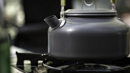 Camp tea kettle for brewing coffee or tea.