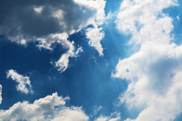 Fototapeta premium white cloud and sunlight shining and pass on blue sky