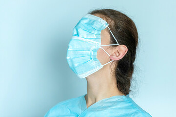 Woman is wearing two masks over her face, concept of taking precautions to avoid COVID-19