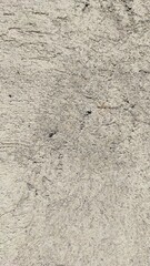 Abstract defocused background photo of a flat wall covered with cement