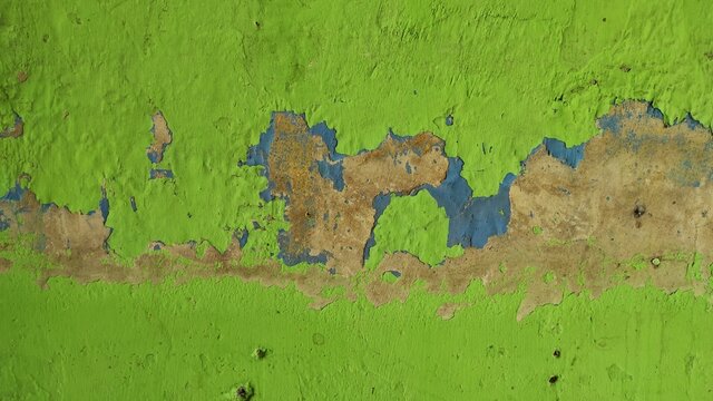 Abstract Defocused Background Photo Of A Green House Wall With A Lot Of Paint Peeling Off
