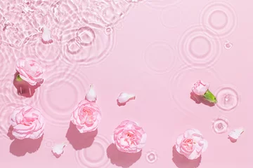 Fototapeten Water background. Pink aqua texture, surface of ripples, transparent, flower, shadows and sunlight. Spa and cosmetic concept background. Flat lay, top view, copy space, banner © uv_group