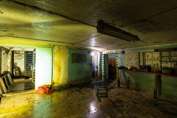 an abandoned bomb shelter with paraphernalia