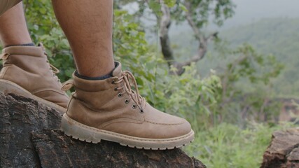 Shoes of traveler getting ready for hiking.