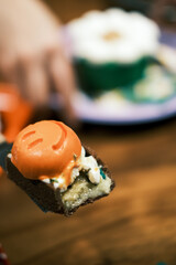 With dessert in one hand.