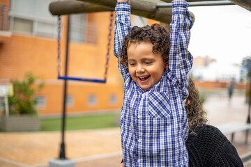 Cute little boy playing happily in the park