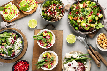 Vegan dishes assortment on gray background.