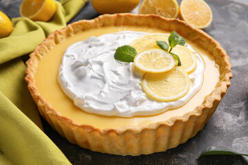 Delicious lemon tart on grunge background