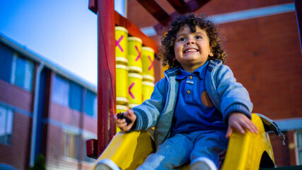 Fototapeta na wymiar Cute little boy playing happily in the park
