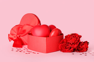 Gift box for Valentine's Day and roses on pink background