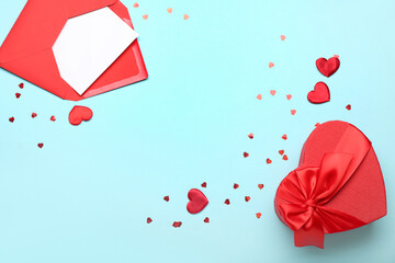 Gift box for Valentine's Day and envelope on blue background