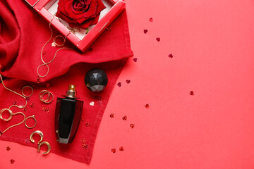 Perfume and accessories for Valentine's day on red background