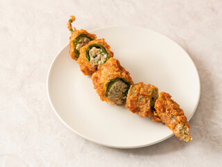 Fried chilli pepper stuffed minced meat and vegetables
