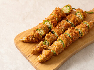 Fried chilli pepper stuffed minced meat and vegetables