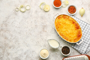Baking dish with tasty English fish pie on light background