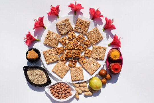 Makar sankrant festival special food Peanut chikki ,Til chikki bars made of Jaggery, sesame seeds and ground nuts. Also eaten jujube fruits and pooja of kanku haldi and other ingredients to make chiki