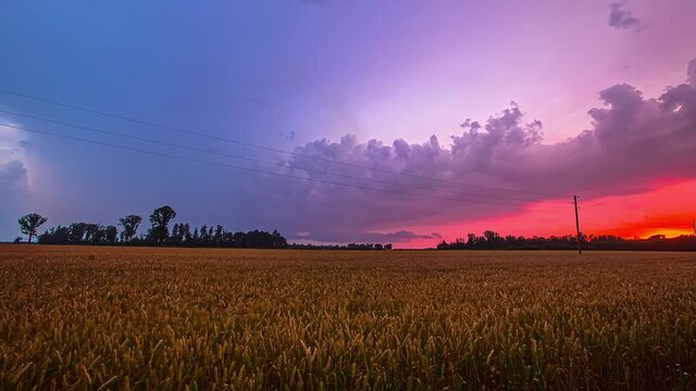 Time lapse slow motion shot on purplish pink cloudy field and moving clouds evening, fusion clip HD wide angle view