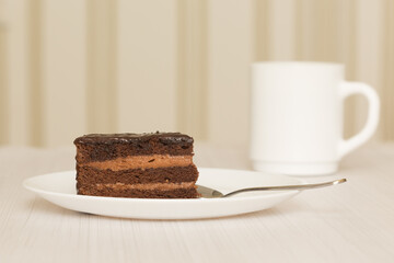 Chocolate cakeclose-up is on a white plate. - 480096120
