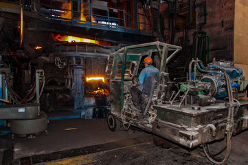 a worker of a metallurgical plant in a foundry