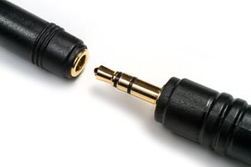 Plug and socket for connecting stereo headphones.