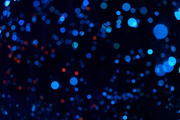 Fantastic blurry and bokeh dark blue theme background in the mystry cave.