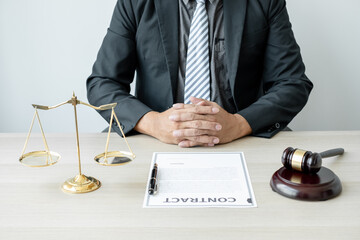 Professional man lawyers work at a law office There are scales, Scales of justice, judges gavel, and litigation documents. Concepts of law and justice