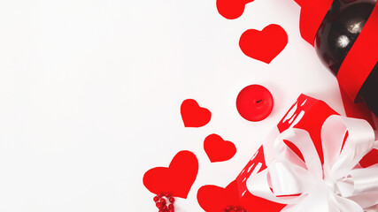 Valentine's day greeting card template. white background with small red hearts, bottle of wine with gift box. Copy space. Flat lay, top view