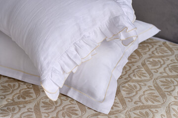 Linen cotton textile bedclothes. Organic and natural linen. Cozy bedroom interior. Beautiful light. Morning mood. 