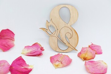 Wooden number 8 in rose petals