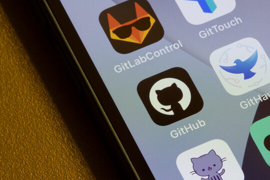 Portland, OR, USA - Jan 12, 2022: GitHub mobile app icon is seen on an iPhone. GitHub is a code hosting platform for version control and collaboration owned by Microsoft.