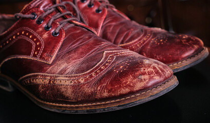 worn old leather scratches and scuffs on men oxford shoes