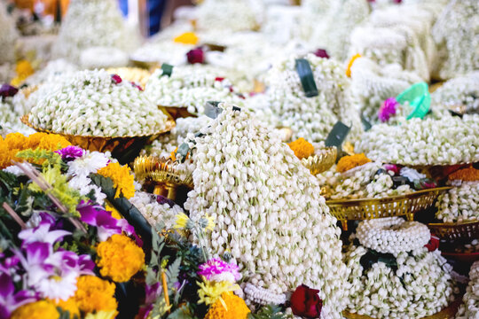 Jasmine garland flowers pile on tray for repect to buddha statue (Luang Por Tan Jai )for wishing a lucky at Phra That Doi Kham temple in Chiang Mai of Thailand