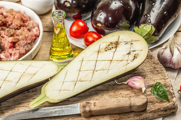 Stuffed eggplant ready to bake with ground meat, vegetables, and spices