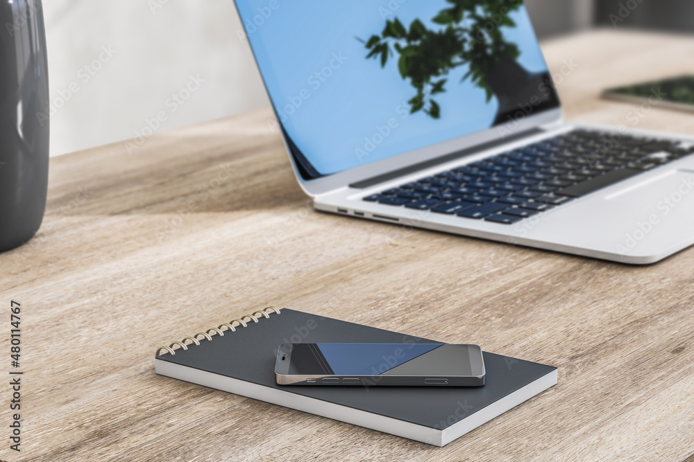 Aufkleber close up of wooden office desktop with smartphone, notepad and laptop with reflections on screen. 3d