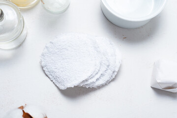 White cotton reusable face make up rounds. On toilet table.