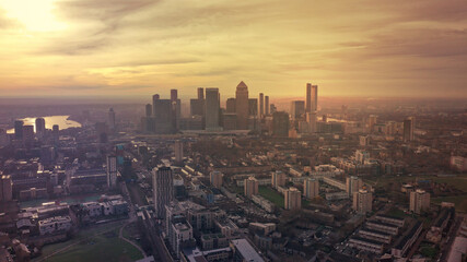 Aerial drone photo of iconic skyscraper banking and business complex of Canary Wharf at sunset, Docklands, London, United Kingdom