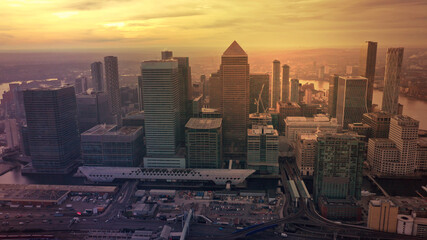 Obraz premium Aerial drone photo of iconic skyscraper banking and business complex of Canary Wharf at sunset, Docklands, London, United Kingdom
