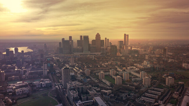 Aerial drone photo of iconic skyscraper banking and business complex of Canary Wharf at sunset, Docklands, London, United Kingdom © aerial-drone