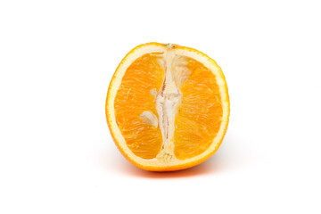 An orange cut in half on a white background, isolated fruit.