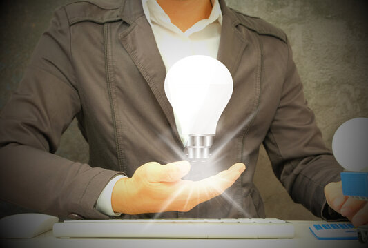 idea, invention, and inspiration with glowing light bulb in hand. You can build a one-of-a-kind notion by using glow-in-the-dark lights and glitter.