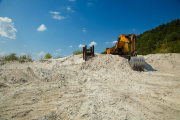 dirty industrial work with pollution of environmental space, excavator dig canal for infrastructure...