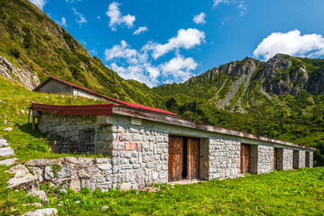 Fototapeta na wymiar Carnic Mountains. Ponds, huts and breathtaking views.
