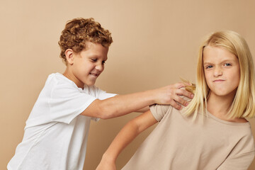 Portrait of cute children fun friendship entertainment beige background