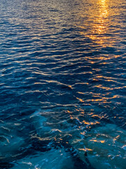 Sparkles of the sunshine on the sea water surface, natural colors