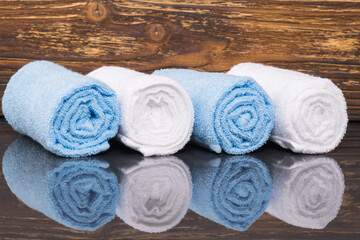 Obraz na płótnie Canvas blue and white towels for spa treatments, background close-up